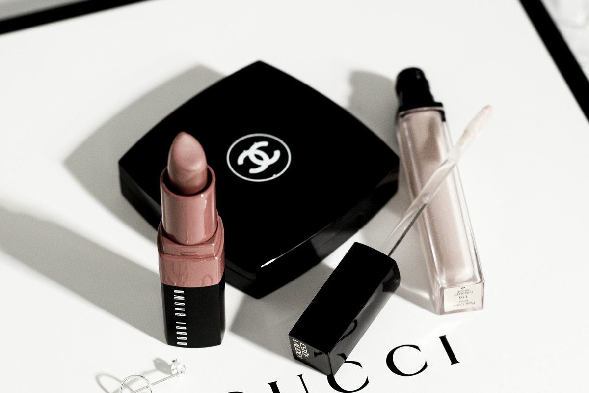 Luxury compact and lipsticks arranged on a designer box
