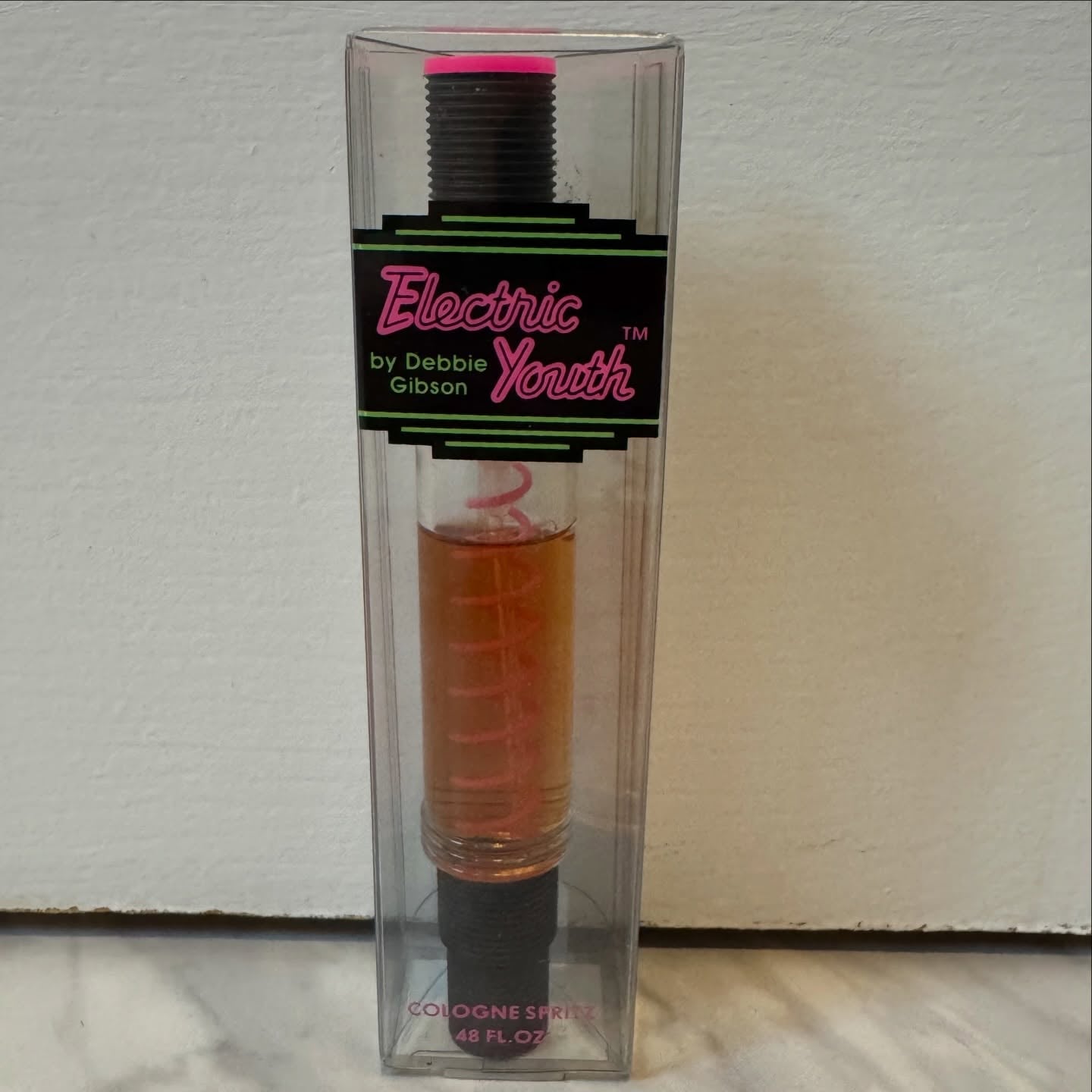 Vintage Electric Youth by Debbie Gibson cologne spritz, pink spiral visible in the bottle, in its original clear packaging
